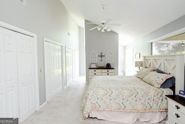 1737 Green Acres Dr, Vidalia, GA 30474 - carpeted bedroom featuring two closets, a ceiling fan, high vaulted ceiling, and visible vents