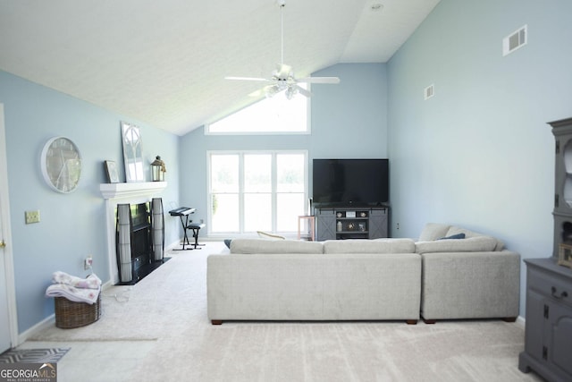 1737 Green Acres Dr, Vidalia, GA 30474 - carpeted living area featuring a fireplace, high vaulted ceiling, a ceiling fan, baseboards, and visible vents