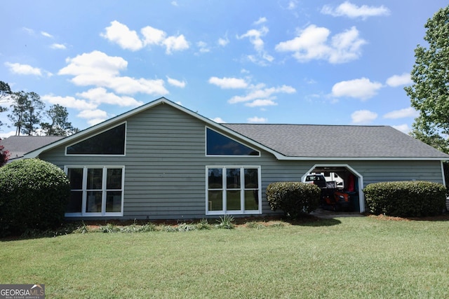 1737 Green Acres Dr, Vidalia, GA 30474 - back of house with roof with shingles and a yard