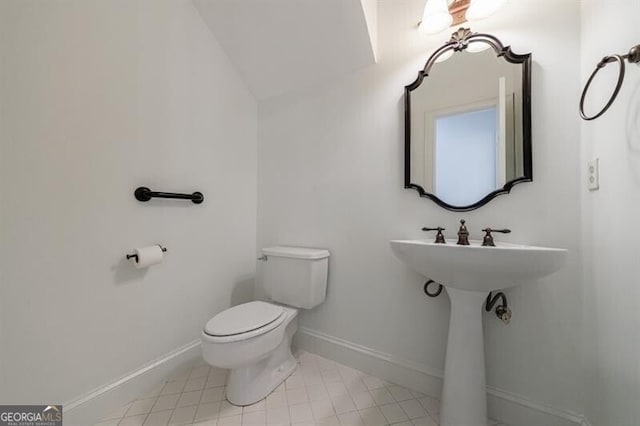 1730 Point Pleasant SE, Smyrna, GA 30080 - bathroom with toilet, baseboards, tile patterned floors, and lofted ceiling