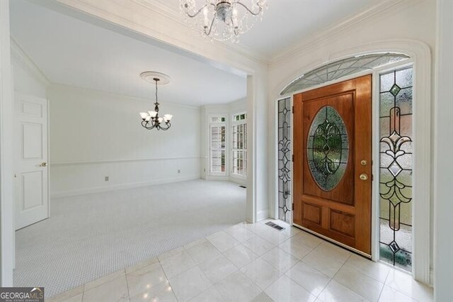 1730 Point Pleasant SE, Smyrna, GA 30080 - carpeted entryway featuring crown molding, baseboards, a notable chandelier, and visible vents