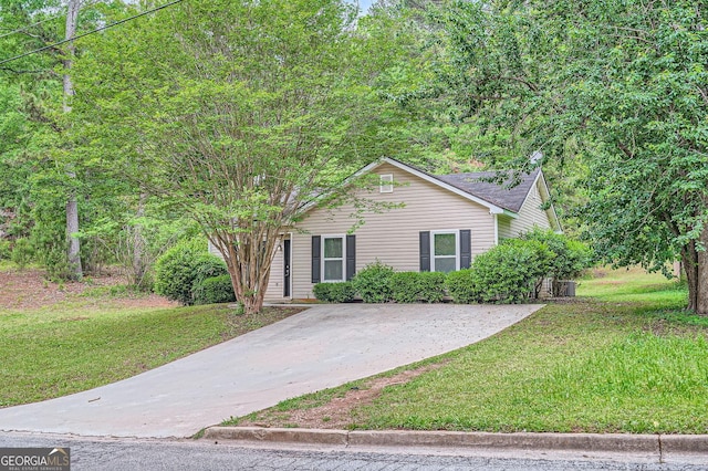 7112 Greenway Cv SW, Covington, GA 30014 - view of front of property with driveway and a front lawn
