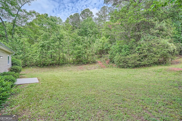 7112 Greenway Cv SW, Covington, GA 30014 - view of yard featuring a wooded view