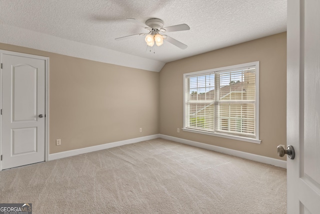 102 Herons Nest Cir, Kingsland, GA 31548 - carpeted spare room featuring baseboards, a ceiling fan, a textured ceiling, and vaulted ceiling