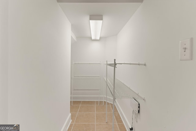 102 Herons Nest Cir, Kingsland, GA 31548 - walk in closet featuring light tile patterned floors
