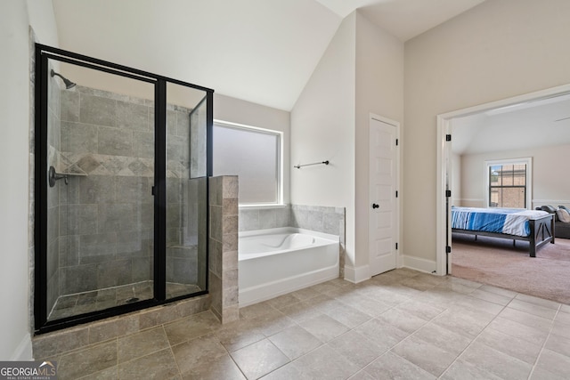 1314 Bentley Estates Dr, Dacula, GA 30019 - ensuite bathroom featuring a stall shower, a bath, lofted ceiling, tile patterned floors, and baseboards
