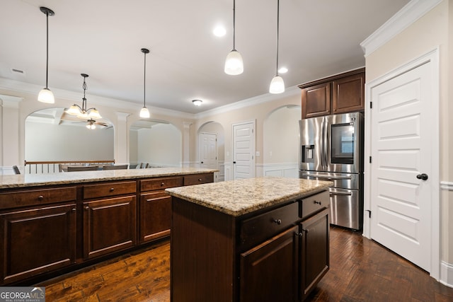 1314 Bentley Estates Dr, Dacula, GA 30019 - kitchen featuring stainless steel fridge with ice dispenser, arched walkways, ornate columns, ornamental molding, and hanging light fixtures