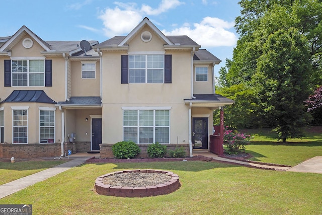 7293 Bridlewood Ct, Jonesboro, GA 30236 - view of property featuring brick siding, a front yard, and stucco siding