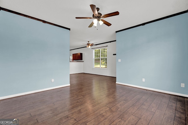 7293 Bridlewood Ct, Jonesboro, GA 30236 - unfurnished living room with a ceiling fan, baseboards, ornamental molding, and wood finished floors