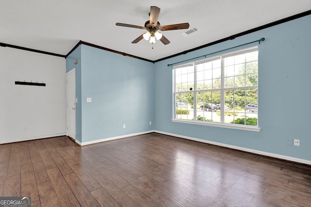 7293 Bridlewood Ct, Jonesboro, GA 30236 - unfurnished room with crown molding, visible vents, dark wood-style flooring, baseboards, and ceiling fan