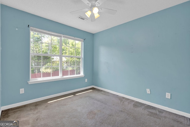 7293 Bridlewood Ct, Jonesboro, GA 30236 - carpeted spare room featuring visible vents, a textured ceiling, baseboards, and ceiling fan