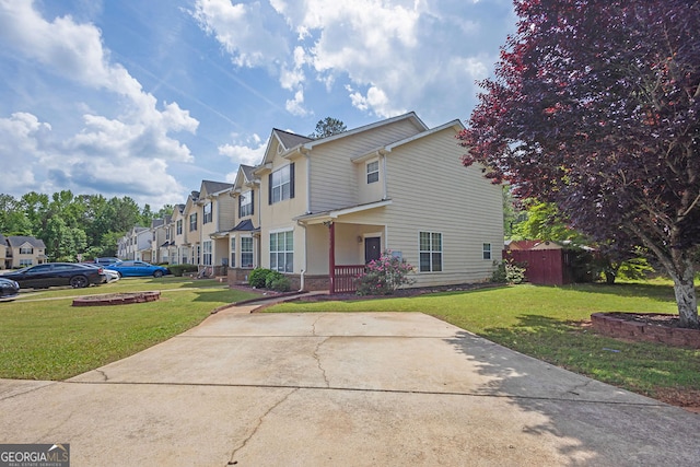 7293 Bridlewood Ct, Jonesboro, GA 30236 - traditional-style house with brick siding, a residential view, and a front lawn