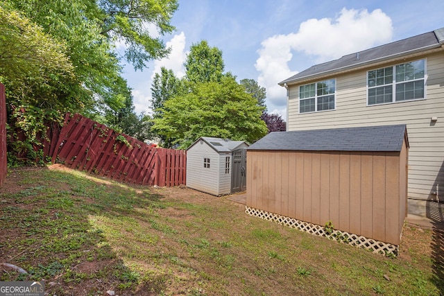 7293 Bridlewood Ct, Jonesboro, GA 30236 - view of yard with fence, an outbuilding, and a shed