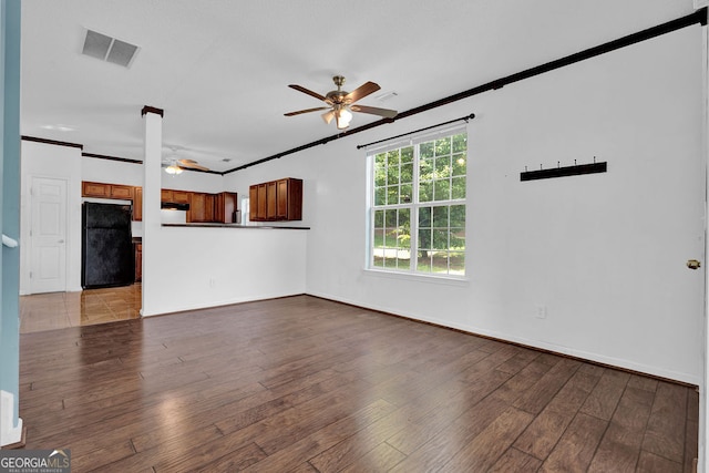 7293 Bridlewood Ct, Jonesboro, GA 30236 - unfurnished living room with visible vents, ornamental molding, wood finished floors, baseboards, and a ceiling fan