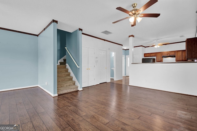 7293 Bridlewood Ct, Jonesboro, GA 30236 - unfurnished living room featuring a ceiling fan, wood finished floors, visible vents, ornamental molding, and stairway