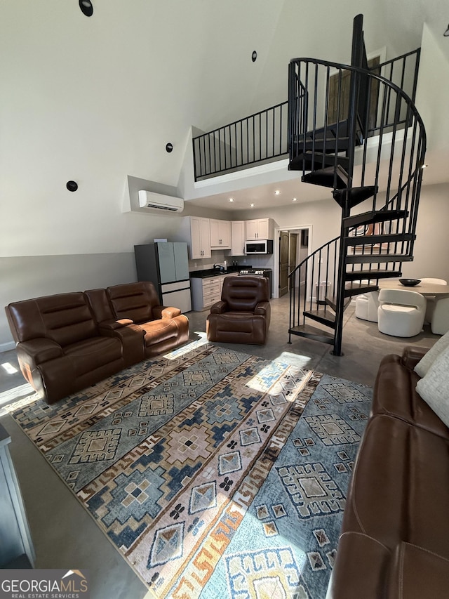 1926 County Rd 621, Woodland, AL 36280 - living area with stairs, a wall unit AC, and a high ceiling