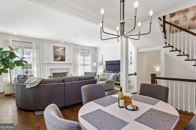 611 Timm Valley Rd NE Unit 2, Atlanta, GA 30305 - dining area featuring a healthy amount of sunlight, an inviting chandelier, ornamental molding, and dark wood-style floors
