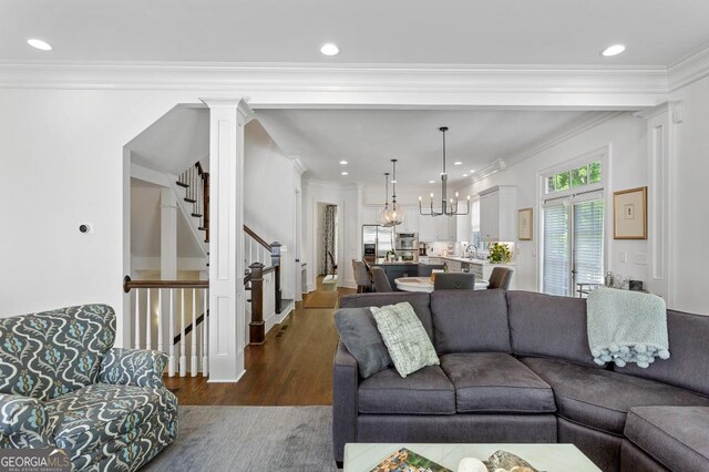 611 Timm Valley Rd NE Unit 2, Atlanta, GA 30305 - living room featuring dark wood-style flooring, a chandelier, recessed lighting, decorative columns, and stairway