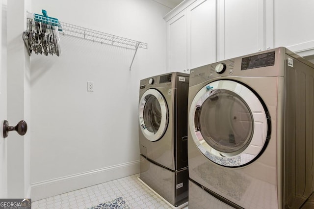 611 Timm Valley Rd NE Unit 2, Atlanta, GA 30305 - clothes washing area featuring baseboards, cabinet space, and independent washer and dryer