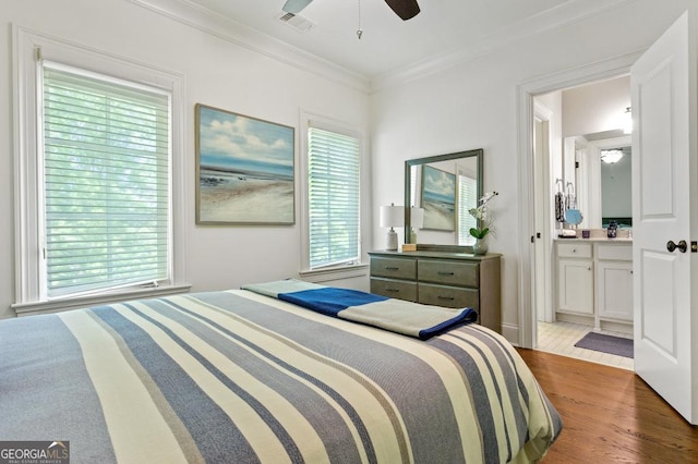 611 Timm Valley Rd NE Unit 2, Atlanta, GA 30305 - bedroom featuring crown molding, ceiling fan, wood finished floors, ensuite bathroom, and visible vents