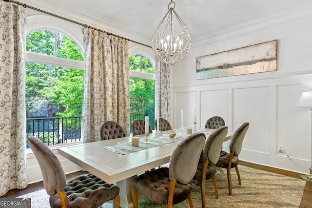 611 Timm Valley Rd NE Unit 2, Atlanta, GA 30305 - dining room with an inviting chandelier, ornamental molding, wood finished floors, and a decorative wall