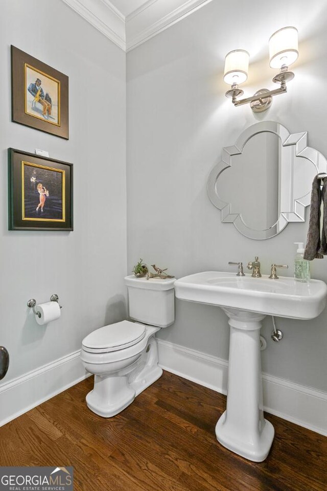 611 Timm Valley Rd NE Unit 2, Atlanta, GA 30305 - half bathroom featuring crown molding, baseboards, and wood finished floors