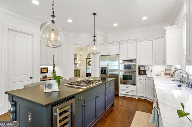 611 Timm Valley Rd NE Unit 2, Atlanta, GA 30305 - kitchen with pendant lighting, wine cooler, white cabinets, a sink, and stainless steel appliances