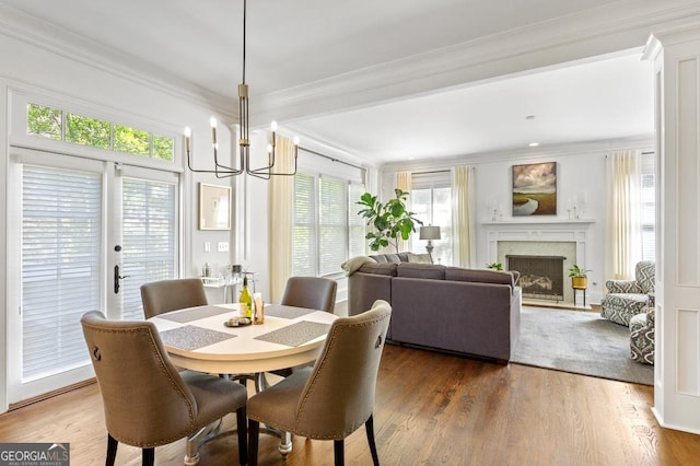 611 Timm Valley Rd NE Unit 2, Atlanta, GA 30305 - dining space featuring an inviting chandelier, plenty of natural light, and ornamental molding