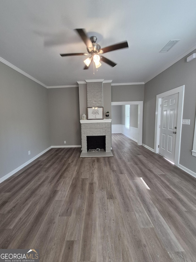 127 S Church St, Bogart, GA 30622 - unfurnished living room with visible vents, dark wood-style flooring, a brick fireplace, a ceiling fan, and baseboards