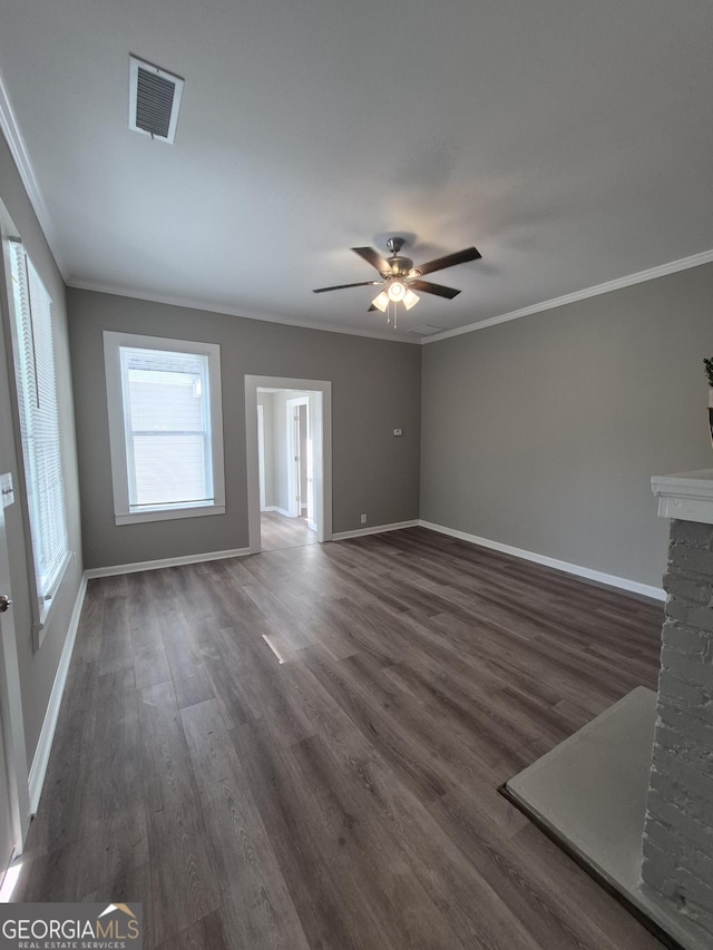 127 S Church St, Bogart, GA 30622 - unfurnished living room featuring crown molding, baseboards, ceiling fan, and visible vents