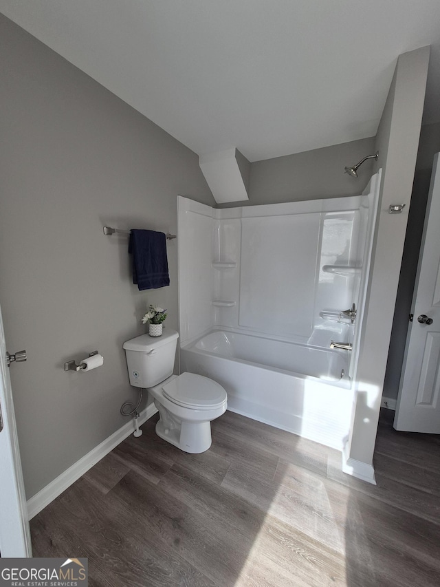 127 S Church St, Bogart, GA 30622 - full bathroom with toilet, tub / shower combination, wood finished floors, baseboards, and vaulted ceiling