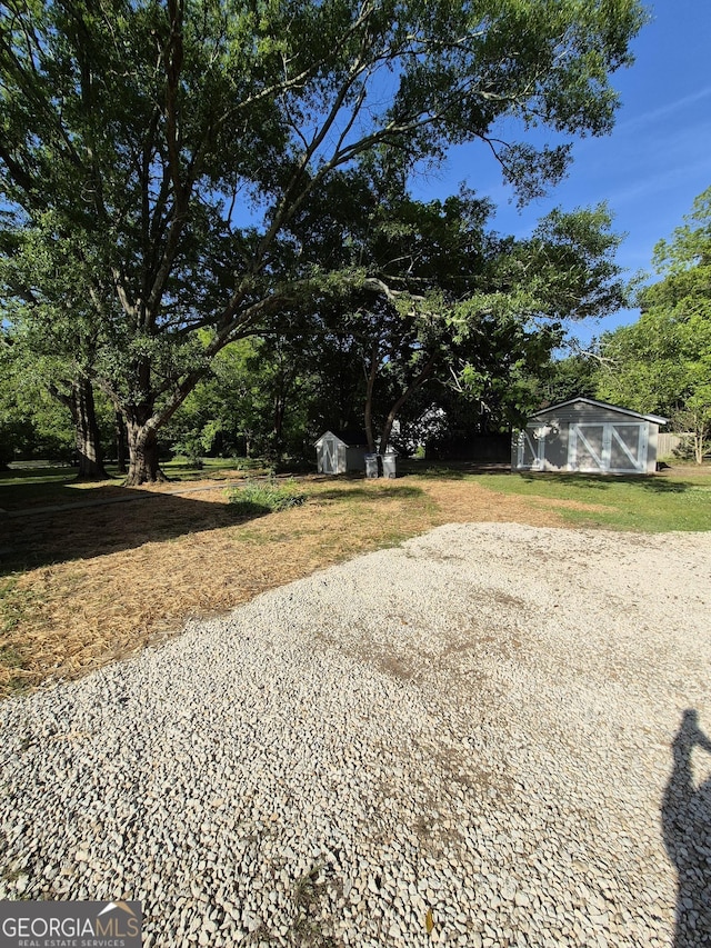 127 S Church St, Bogart, GA 30622 - view of yard with an outdoor structure and a shed