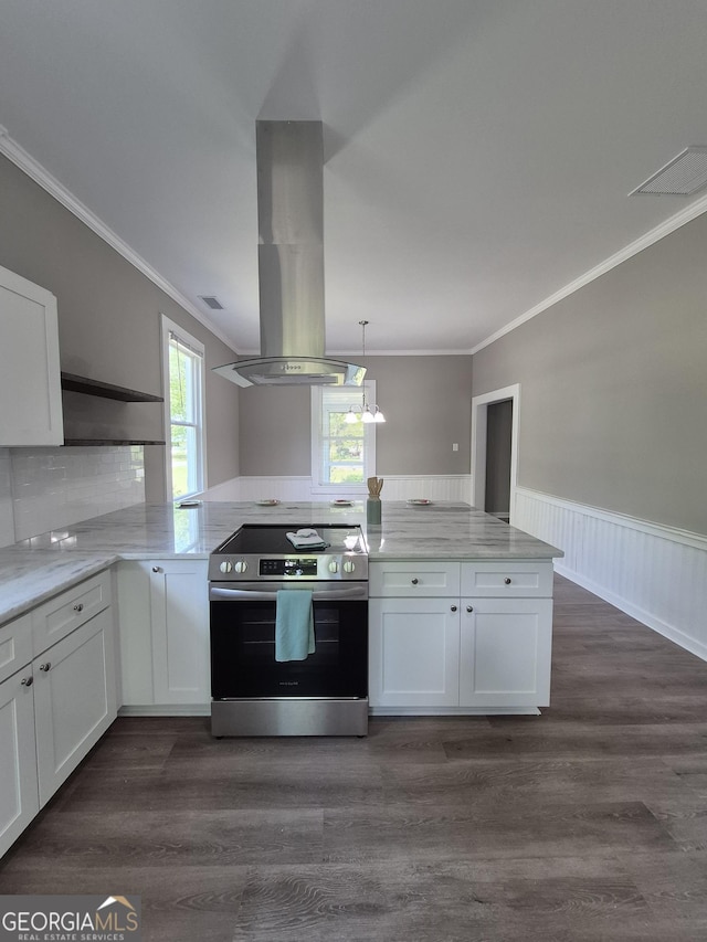 127 S Church St, Bogart, GA 30622 - kitchen featuring white cabinetry, island range hood, crown molding, and stainless steel range with electric cooktop