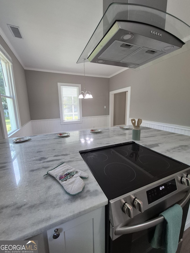 127 S Church St, Bogart, GA 30622 - kitchen featuring a healthy amount of sunlight, an inviting chandelier, stainless steel range with electric stovetop, and visible vents
