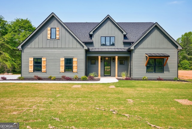 4731 H D Atha Rd, Covington, GA 30014 - modern inspired farmhouse with roof with shingles, a standing seam roof, a front yard, a metal roof, and board and batten siding