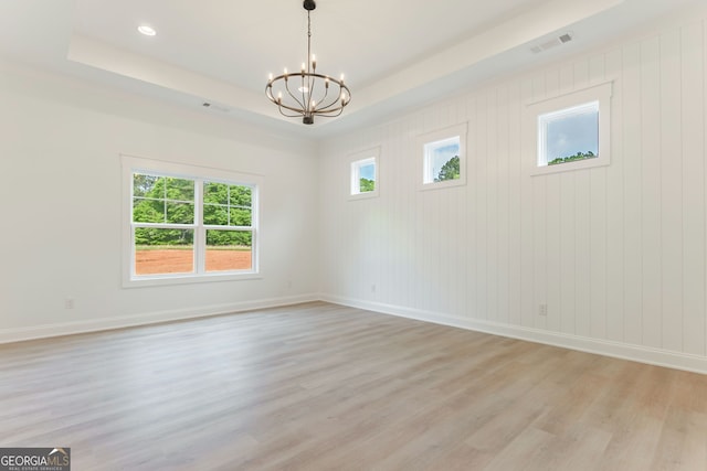 4731 H D Atha Rd, Covington, GA 30014 - unfurnished room with a chandelier, light wood-style floors, a raised ceiling, and recessed lighting