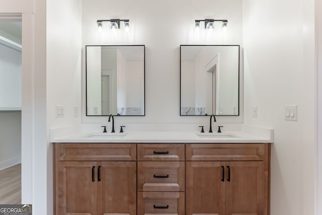 4731 H D Atha Rd, Covington, GA 30014 - full bathroom with double vanity and wood finished floors