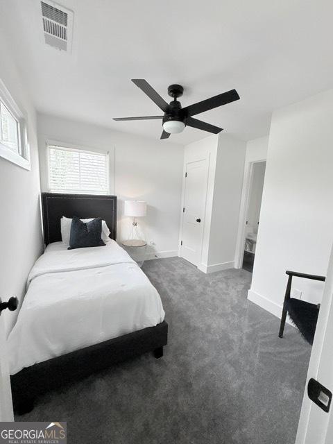 bedroom featuring carpet floors, a ceiling fan, and baseboards