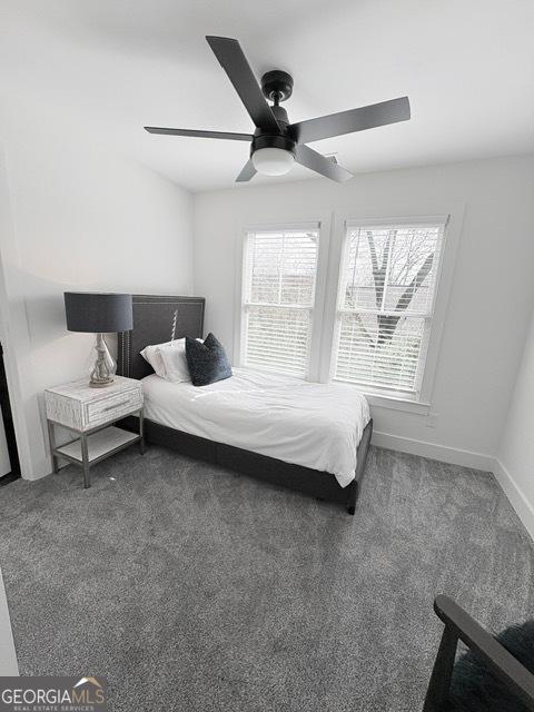 bedroom with carpet floors, baseboards, and ceiling fan