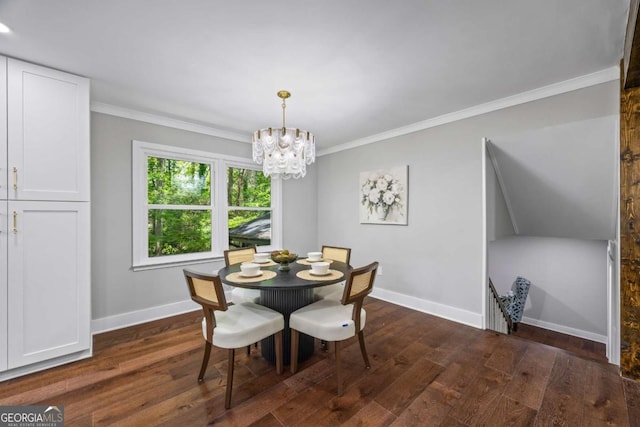 125 Terrell Dr, Athens, GA 30606 - dining room with dark wood-style floors, ornamental molding, and a chandelier