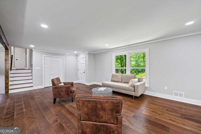 living room featuring stairs, recessed lighting, baseboards, wood finished floors, and visible vents