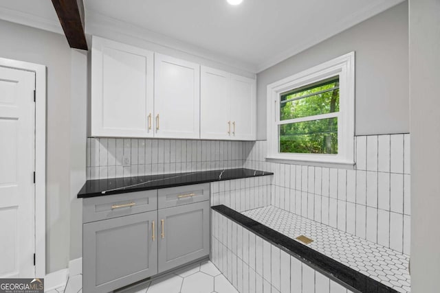 kitchen featuring decorative backsplash, dark countertops, white cabinetry, gray cabinetry, and light tile patterned flooring