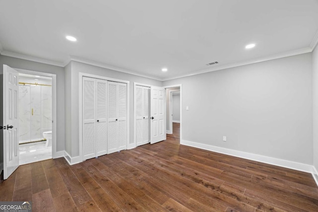 unfurnished bedroom with visible vents, crown molding, baseboards, dark wood-type flooring, and recessed lighting