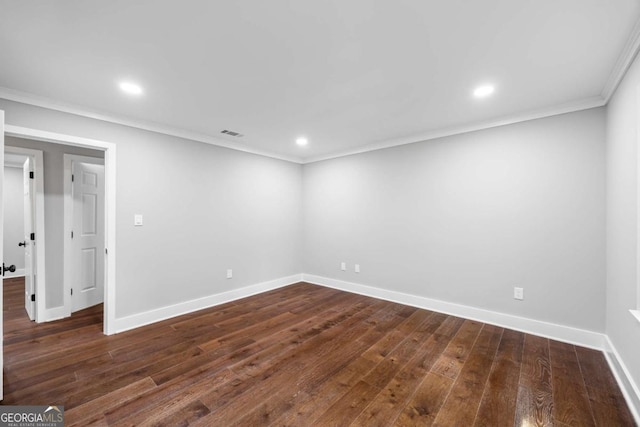 basement featuring visible vents, ornamental molding, baseboards, recessed lighting, and dark wood-type flooring