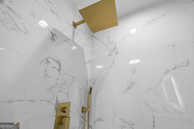 room details with a marble finish shower