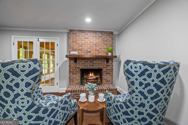 interior space with a brick fireplace, recessed lighting, baseboards, and ornamental molding