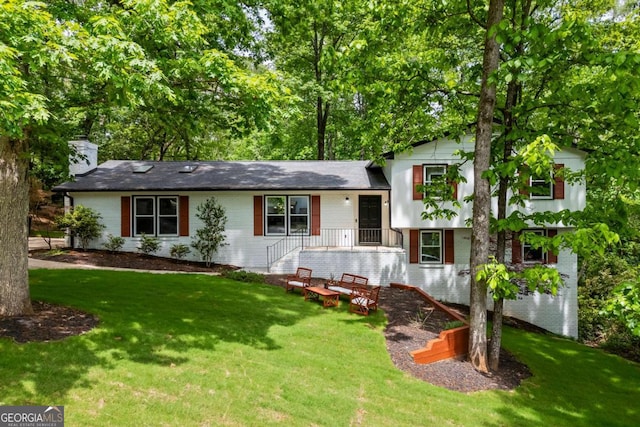 125 Terrell Dr, Athens, GA 30606 - split level home with a chimney, a front yard, and brick siding
