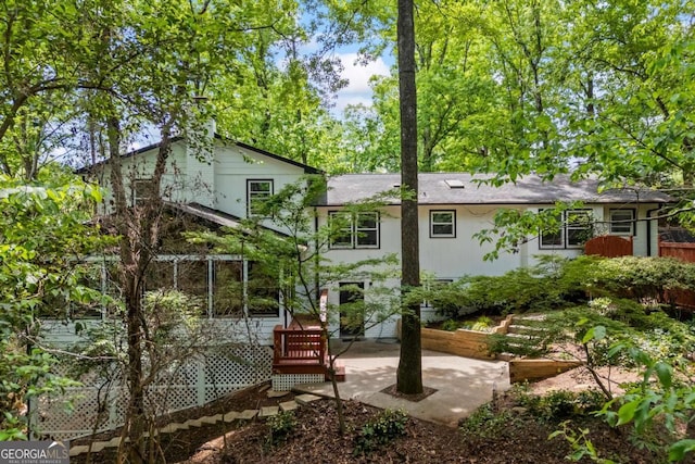 rear view of house featuring a patio