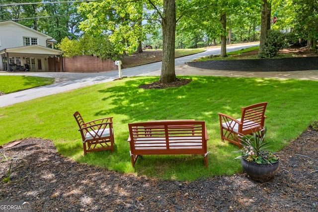 view of community featuring a lawn