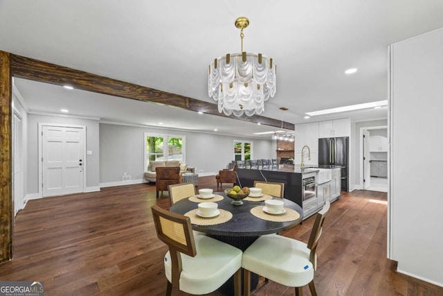 dining room featuring dark wood-style flooring, recessed lighting, baseboards, and a notable chandelier